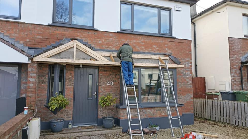 Roof moss removal being carried out on a Dublin roof